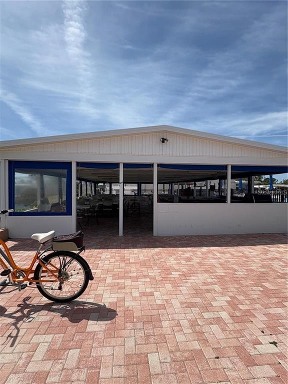 10011 110th Place, Unit 246 Largo, FL 33773 - Photo 29 of 31 a view of swimming pool with outdoor seating