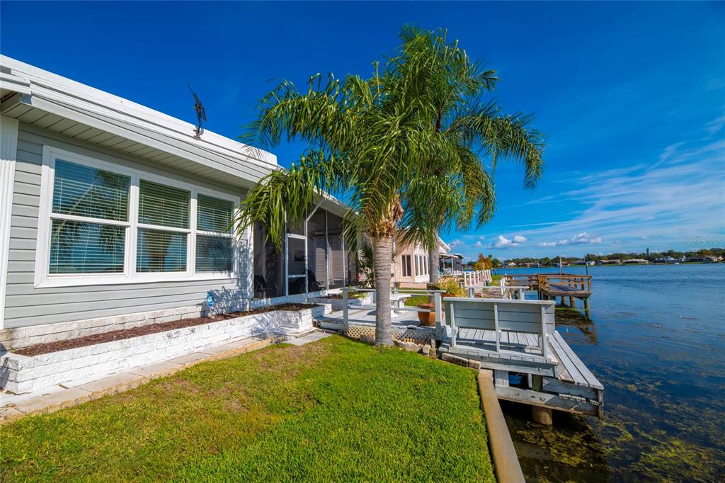 10011 110th Place, Unit 246 Largo, FL 33773 - Photo 3 of 31 a house with trees in front of it