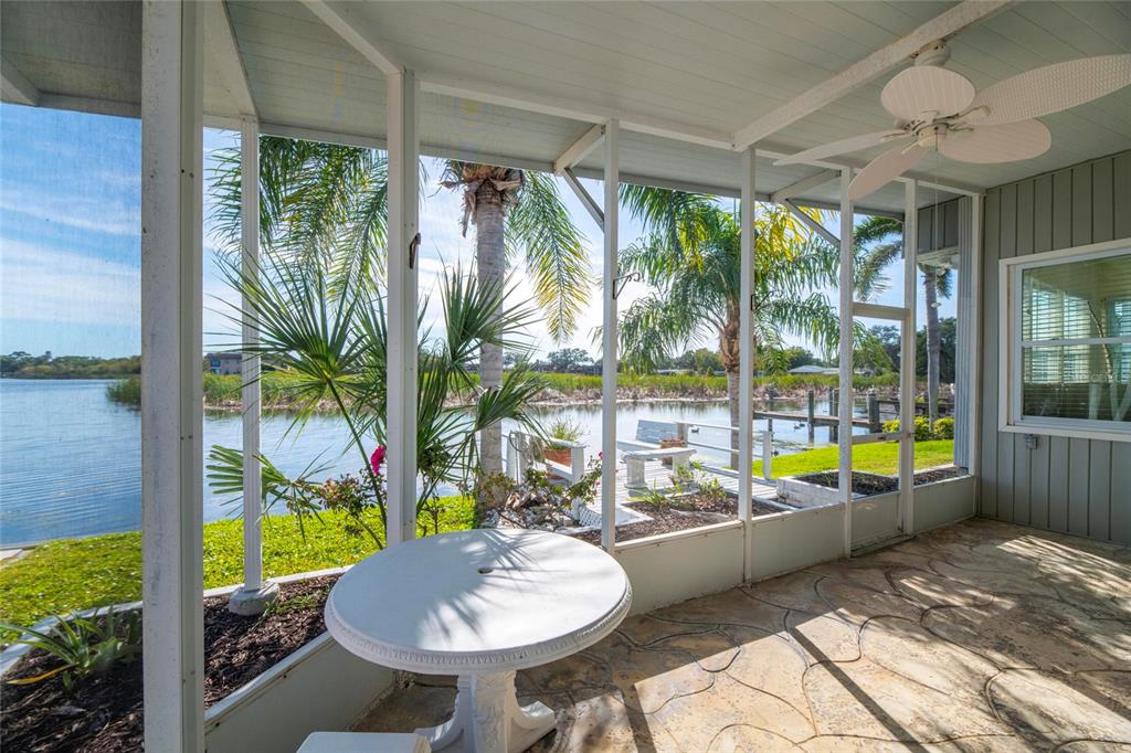 10011 110th Place, Unit 246 Largo, FL 33773 - Photo 5 of 31 a view of a room with a large window and table