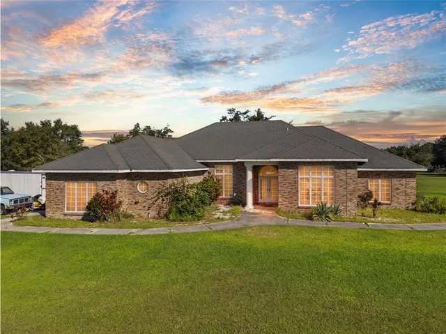 front view of a house with a yard