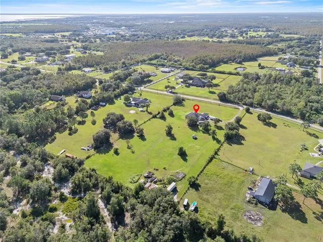 an aerial view of lake residential house with outdoor space
