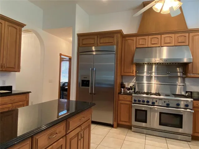 a kitchen with stainless steel appliances a stove and a refrigerator