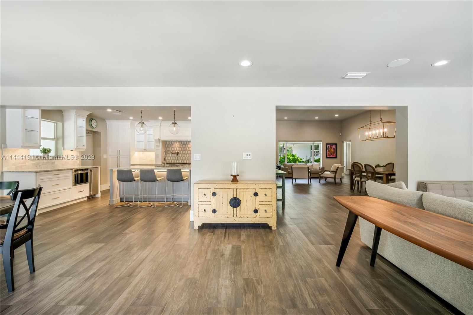 7900 Southwest 129th Terrace Pinecrest, FL 33156 - Photo 15 of 57 a living room with furniture and a wooden floor