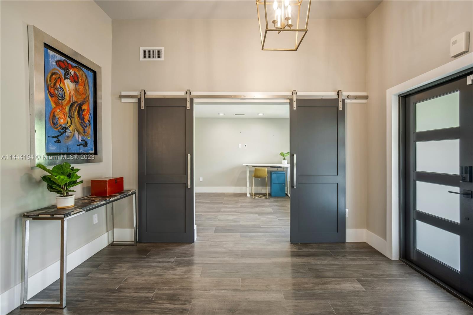 7900 Southwest 129th Terrace Pinecrest, FL 33156 - Photo 16 of 57 a kitchen with stainless steel appliances a refrigerator and cabinets