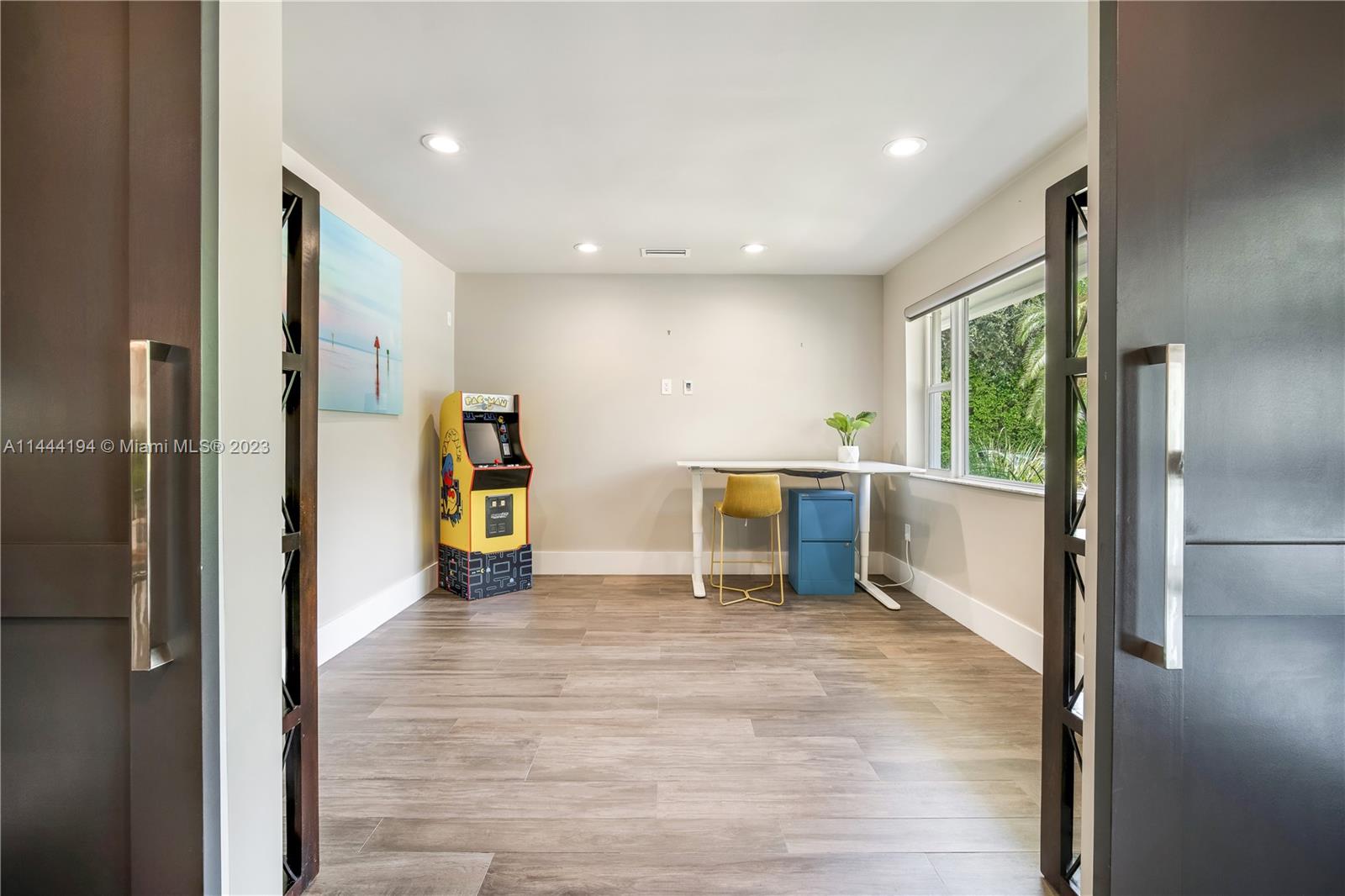 7900 Southwest 129th Terrace Pinecrest, FL 33156 - Photo 18 of 57 a view of a kitchen with a sink and dishwasher a refrigerator with wooden floor