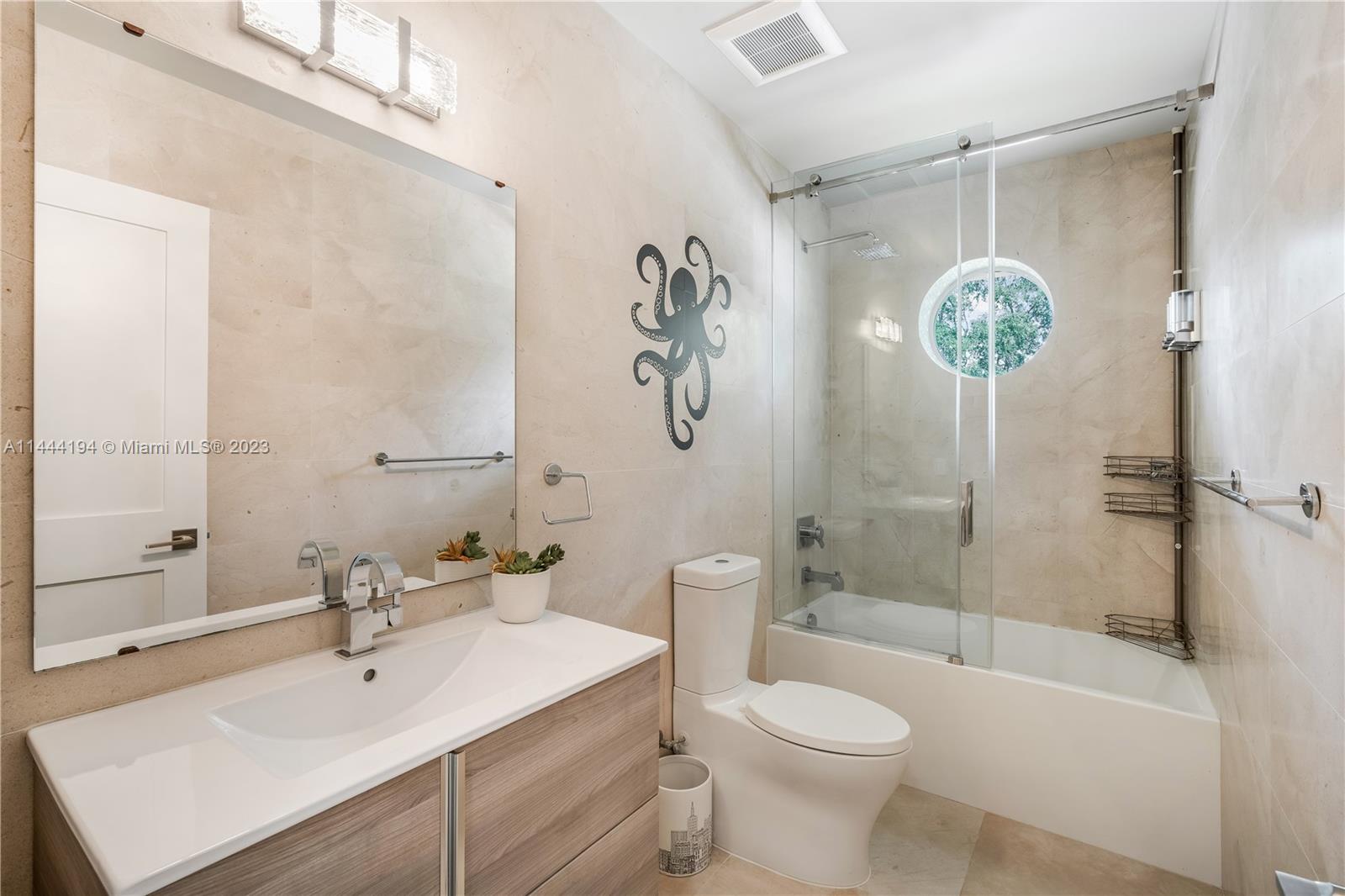 7900 Southwest 129th Terrace Pinecrest, FL 33156 - Photo 20 of 57 a bathroom with a sink toilet and shower