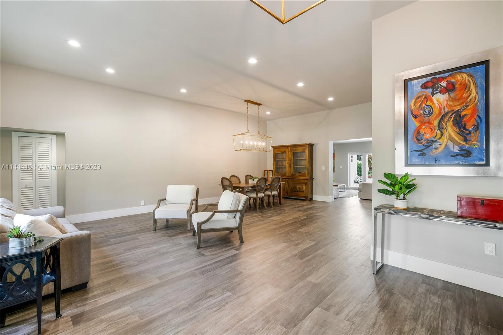 7900 Southwest 129th Terrace Pinecrest, FL 33156 - Photo 3 of 57 a living room with furniture and wooden floor