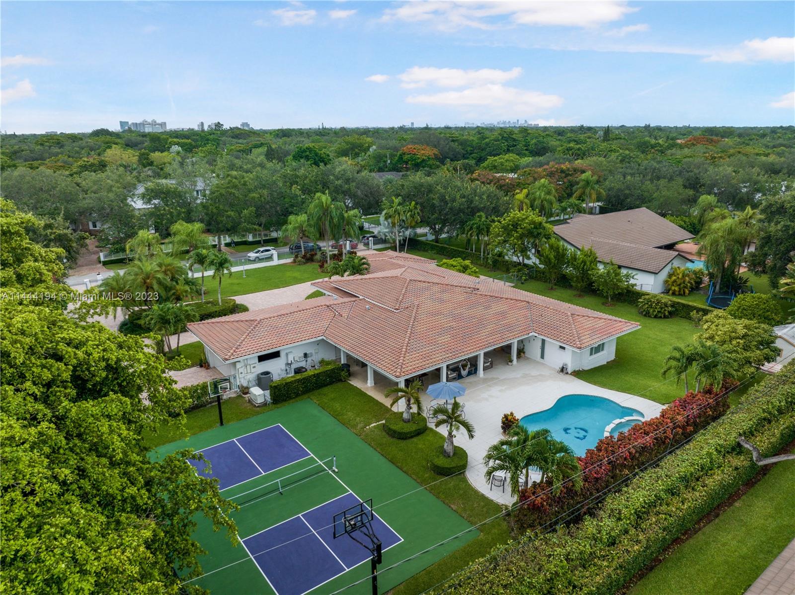 7900 Southwest 129th Terrace Pinecrest, FL 33156 - Photo 52 of 57 an aerial view of residential houses with outdoor space and street view