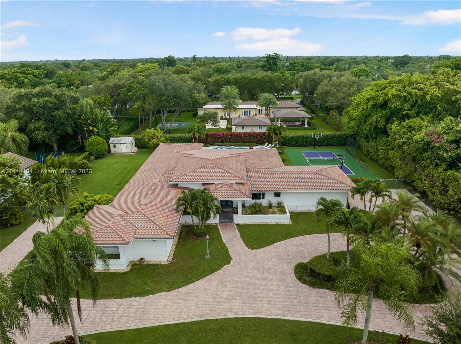 7900 Southwest 129th Terrace Pinecrest, FL 33156 - Photo 55 of 57 an aerial view of a house with garden space and street view
