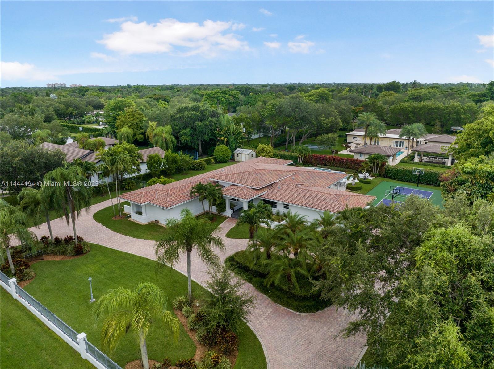 7900 Southwest 129th Terrace Pinecrest, FL 33156 - Photo 56 of 57 a view of a garden with a lot of trees in front of it