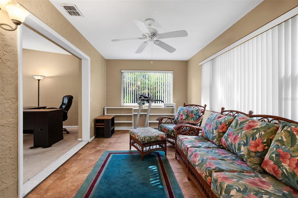 3201 McMath Drive Palm Harbor, FL 34684 - Photo 20 of 59 a living room with furniture and a large window