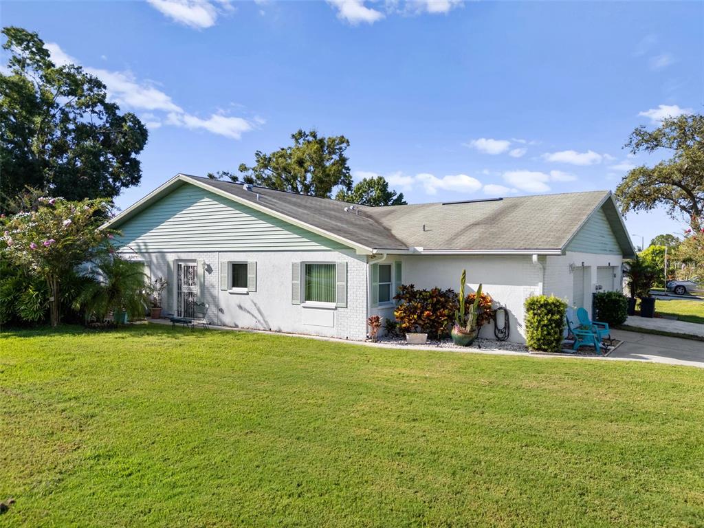 3201 McMath Drive Palm Harbor, FL 34684 - Photo 2 of 59 a view of a house with yard and garage