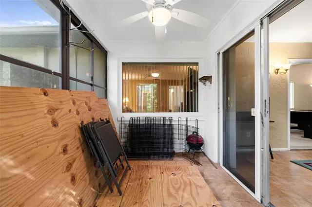 a bedroom with a bed and lamp with window