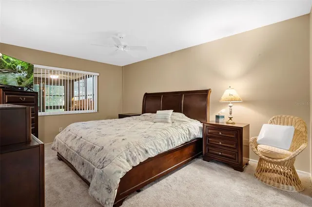 a bedroom with a bed and a television