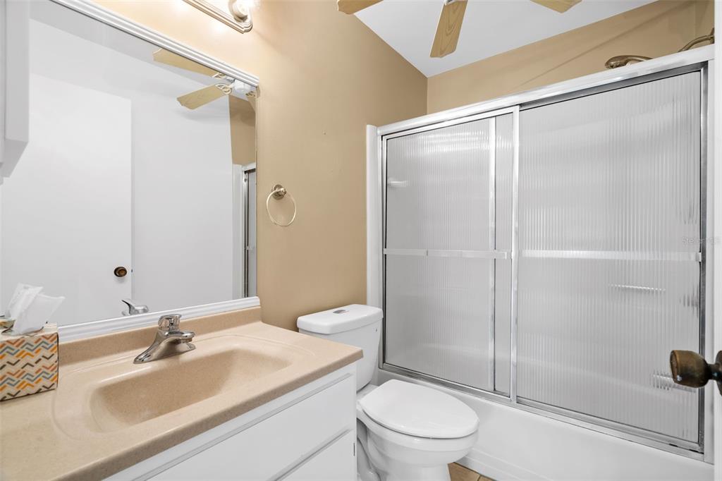 3201 McMath Drive Palm Harbor, FL 34684 - Photo 29 of 59 a bathroom with a sink a toilet and shower