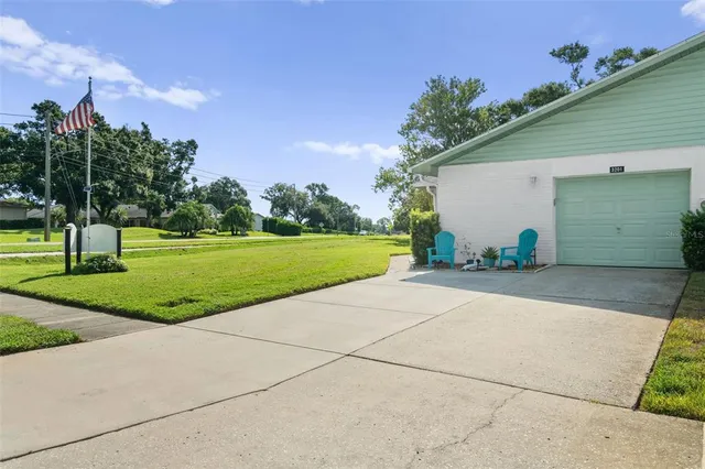 a view of a house with entertaining space and a garage