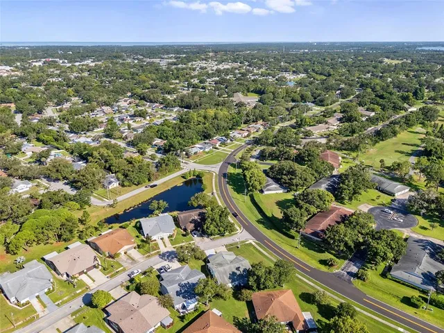 an aerial view of a house with a lake view