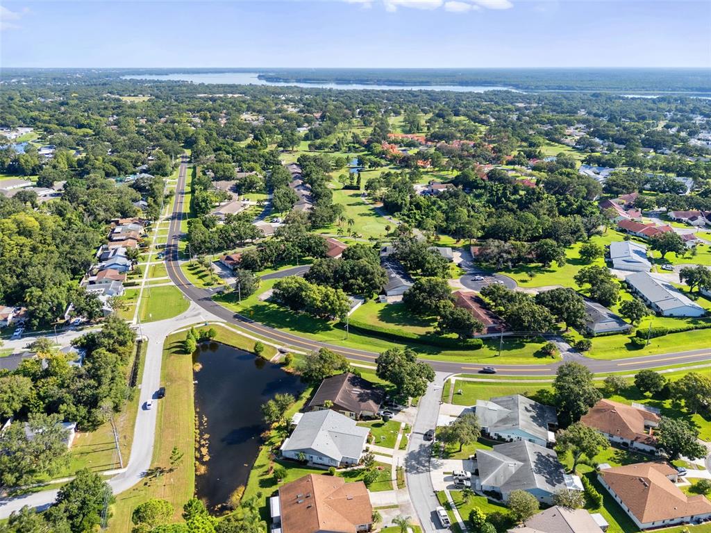 3201 McMath Drive Palm Harbor, FL 34684 - Photo 49 of 59 an aerial view of residential houses with outdoor space and trees
