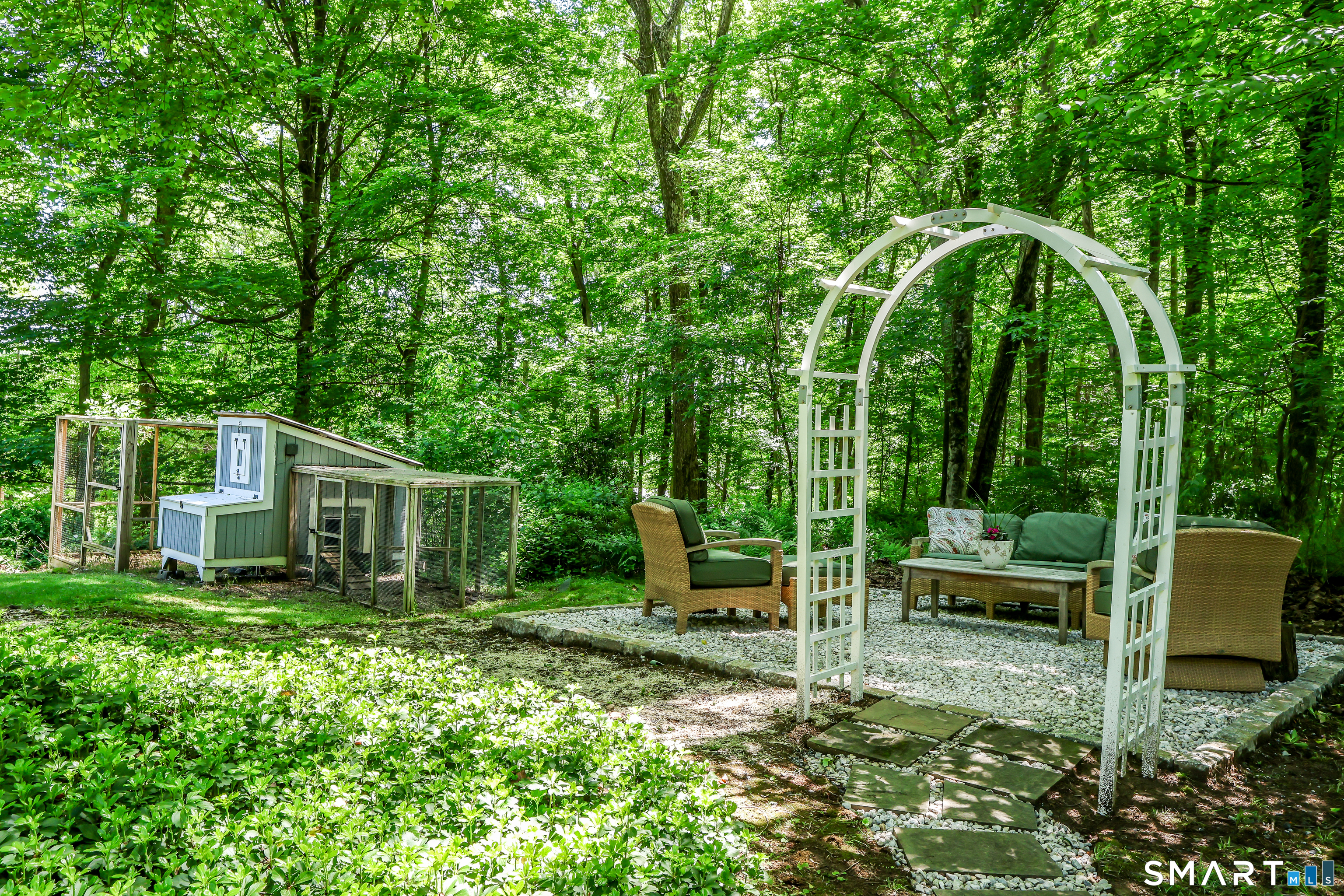 23 Old Green Road Newtown, CT 06482 - Photo 33 of 36 a view of a chair and table in the garden