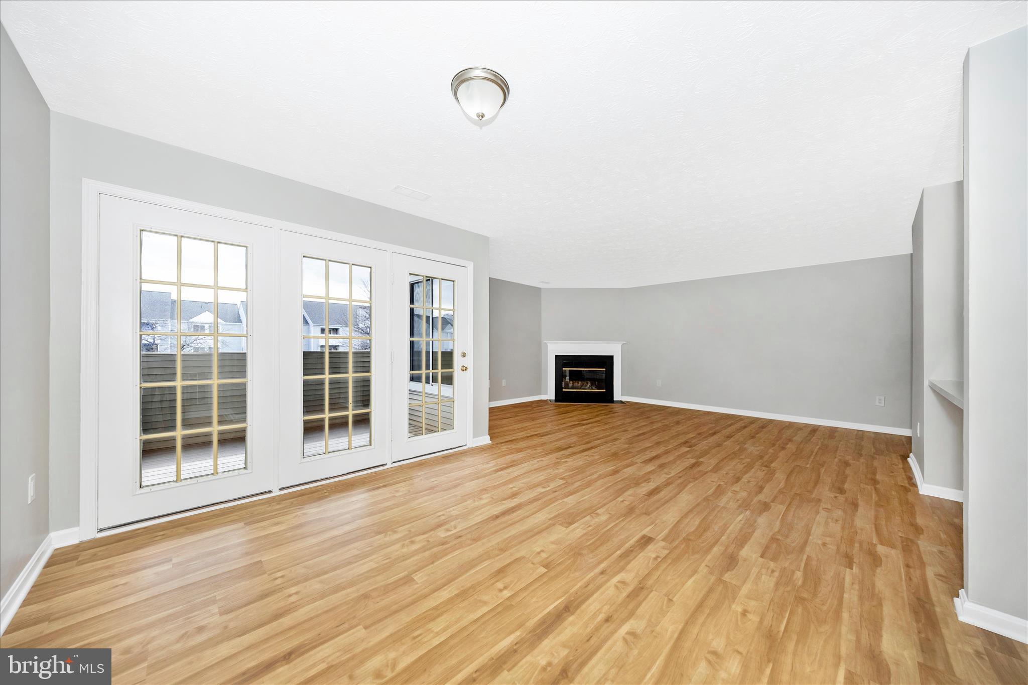 2137 Wainwright Court, Unit 1B Frederick, MD 21702 - Photo 12 of 55 a view of empty room with wooden floor and fan