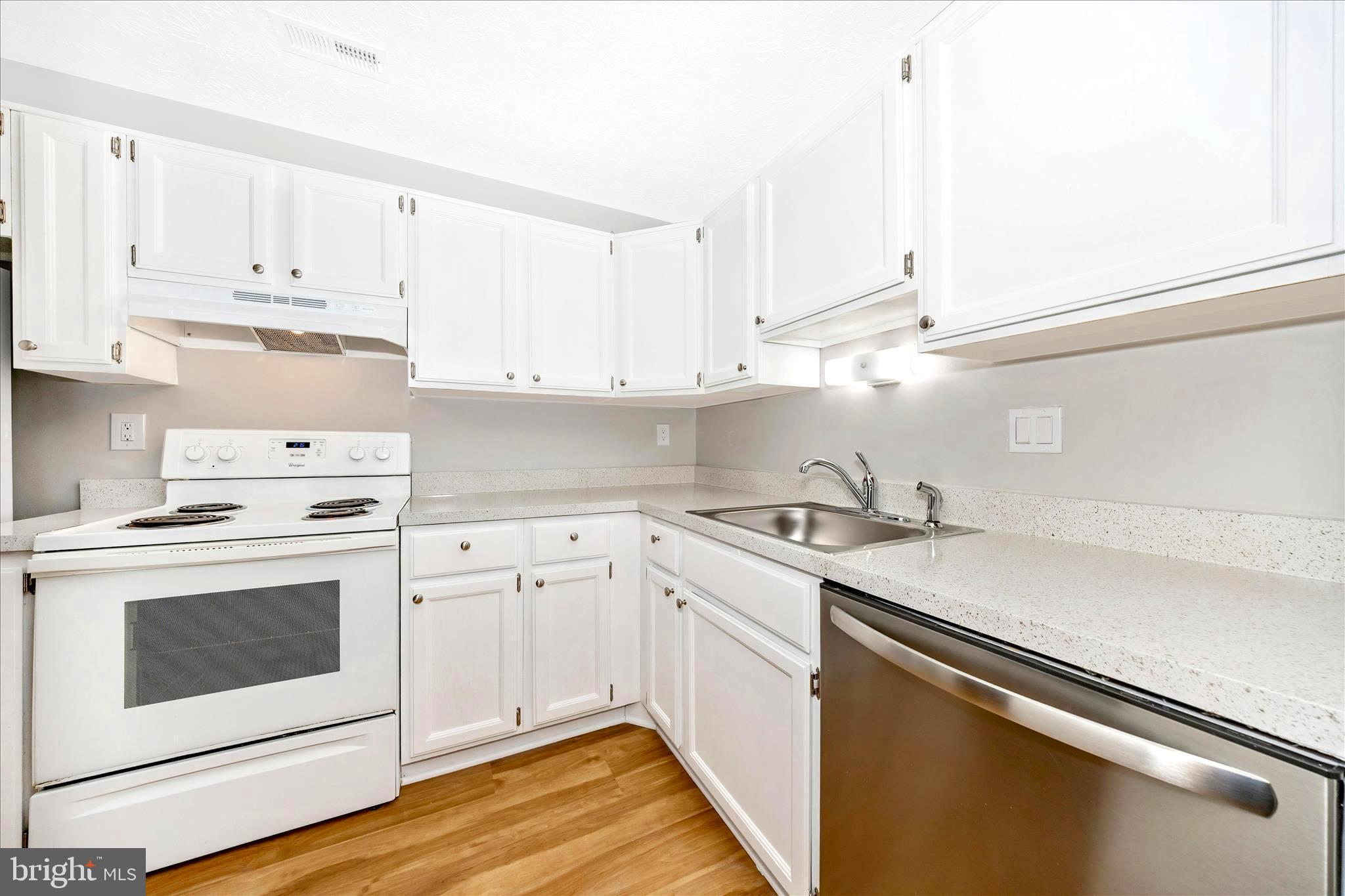 2137 Wainwright Court, Unit 1B Frederick, MD 21702 - Photo 17 of 55 a kitchen with cabinets appliances a sink and a counter