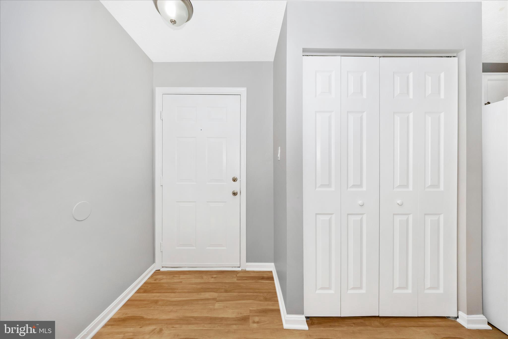 2137 Wainwright Court, Unit 1B Frederick, MD 21702 - Photo 2 of 55 a view of an empty room with wooden floor