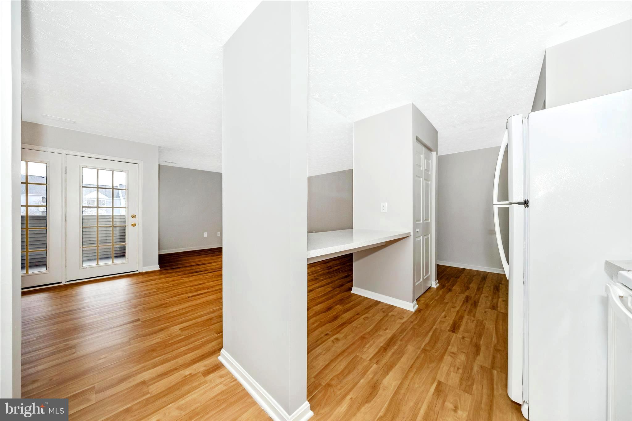 2137 Wainwright Court, Unit 1B Frederick, MD 21702 - Photo 22 of 55 a view of a living room with furniture and wooden floor