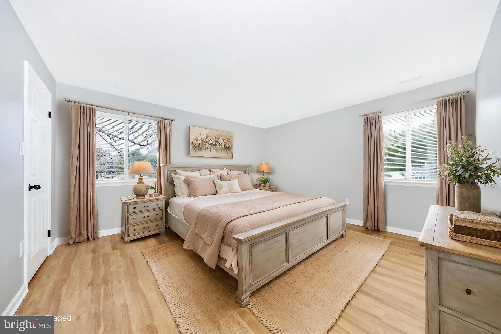 2137 Wainwright Court, Unit 1B Frederick, MD 21702 - Photo 23 of 55 a spacious bedroom with a bed and a large window