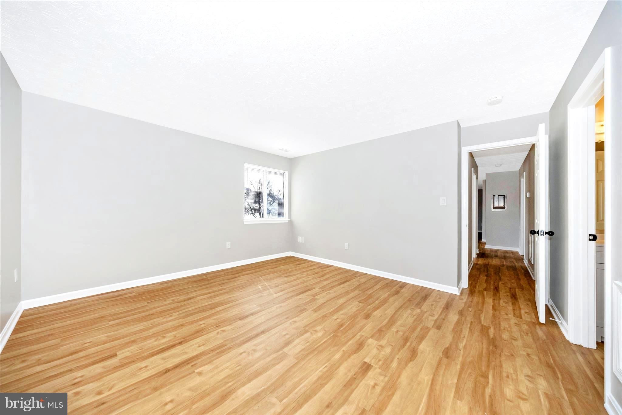 2137 Wainwright Court, Unit 1B Frederick, MD 21702 - Photo 25 of 55 a view of empty room with wooden floor