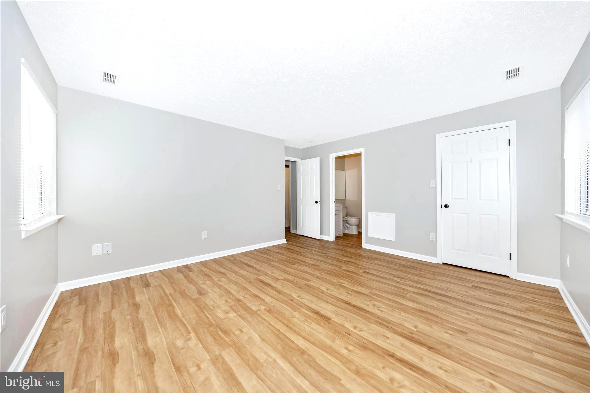 2137 Wainwright Court, Unit 1B Frederick, MD 21702 - Photo 26 of 55 a view of an empty room with wooden floor