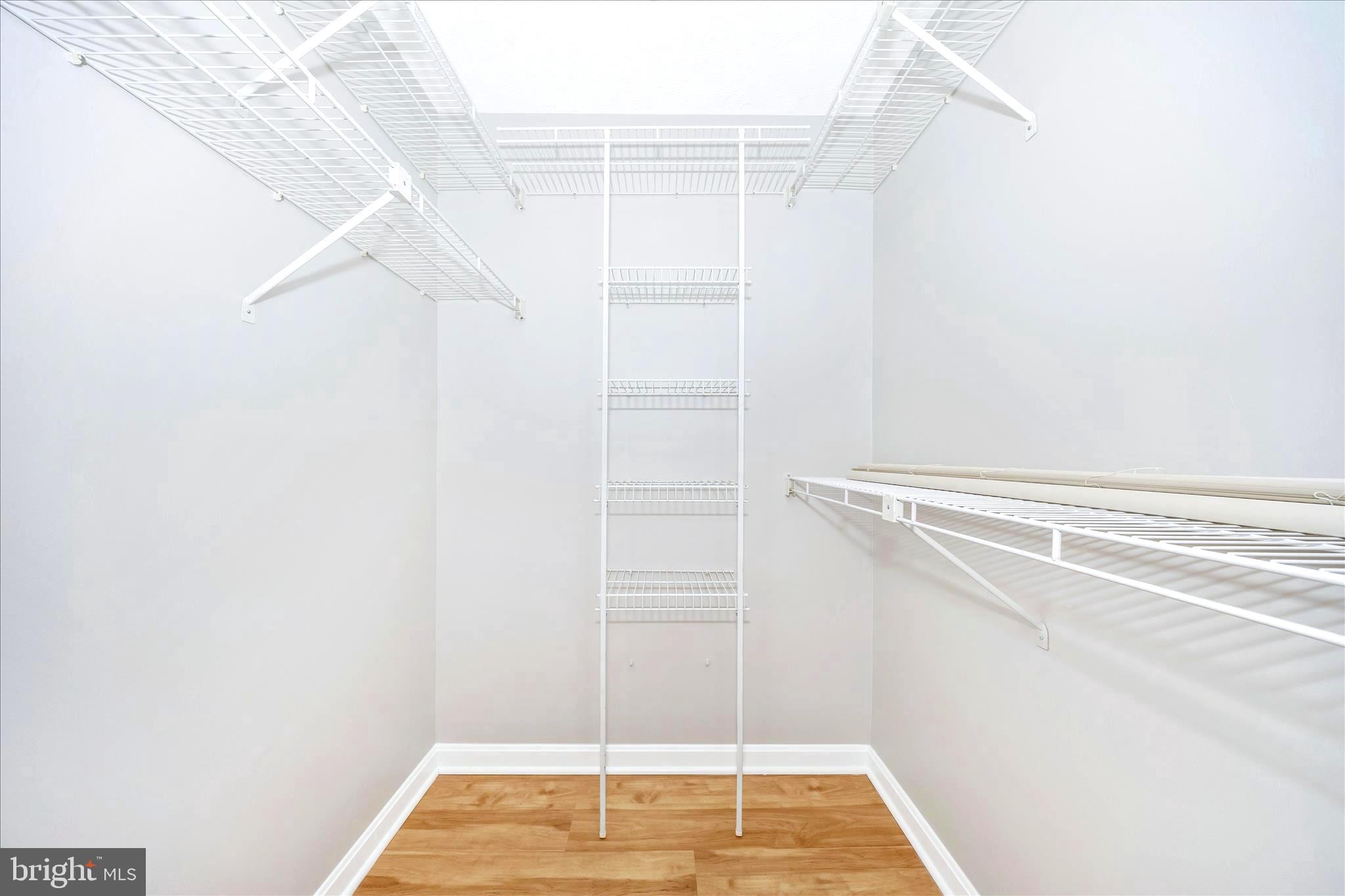 2137 Wainwright Court, Unit 1B Frederick, MD 21702 - Photo 27 of 55 a view of walk in closet with empty racks