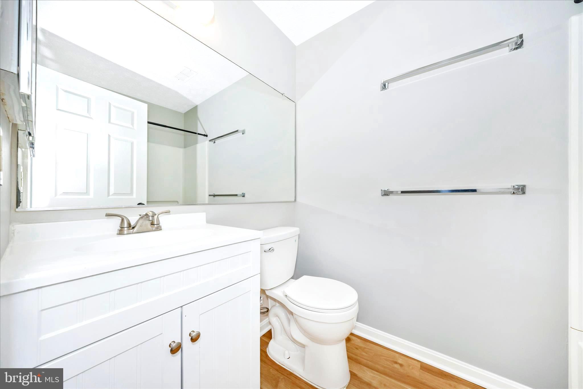 2137 Wainwright Court, Unit 1B Frederick, MD 21702 - Photo 28 of 55 a bathroom with a sink a toilet and a mirror