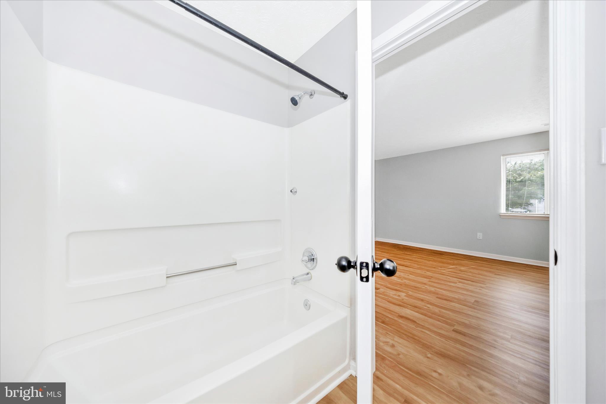 2137 Wainwright Court, Unit 1B Frederick, MD 21702 - Photo 30 of 55 a bathroom with a bathtub and shower