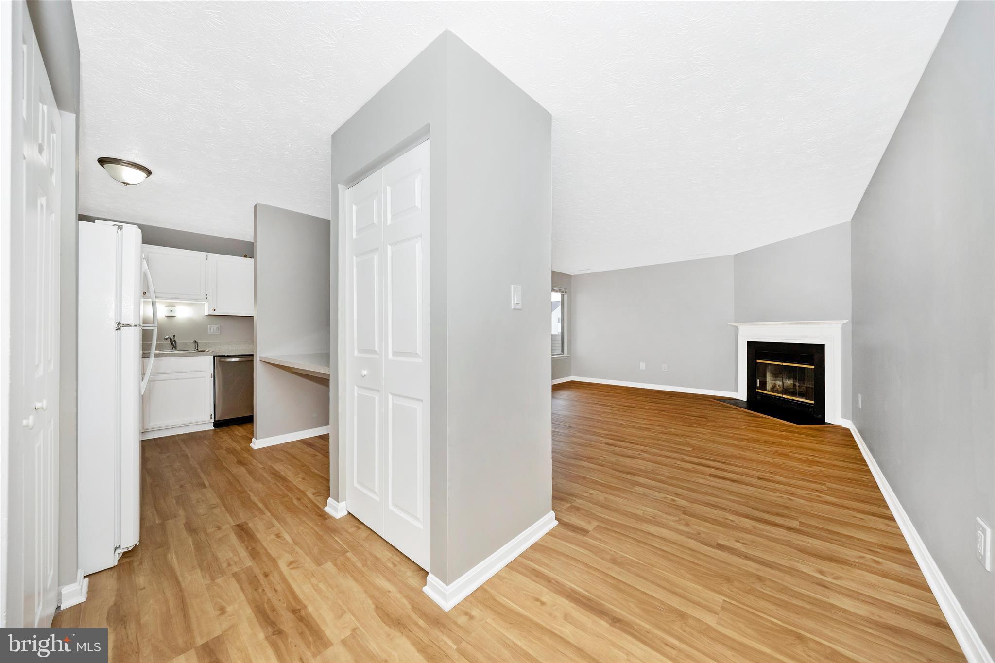2137 Wainwright Court, Unit 1B Frederick, MD 21702 - Photo 3 of 55 a view of a kitchen with wooden floor and a kitchen
