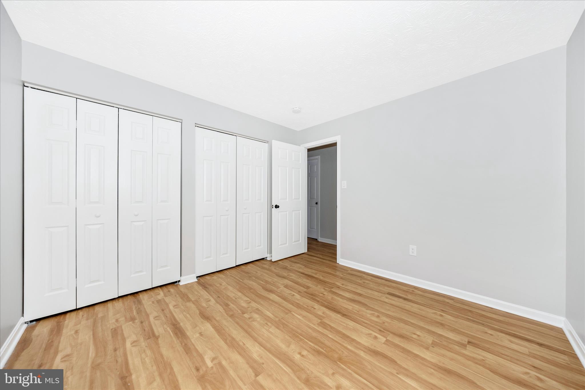 2137 Wainwright Court, Unit 1B Frederick, MD 21702 - Photo 33 of 55 a view of an empty room with wooden floor