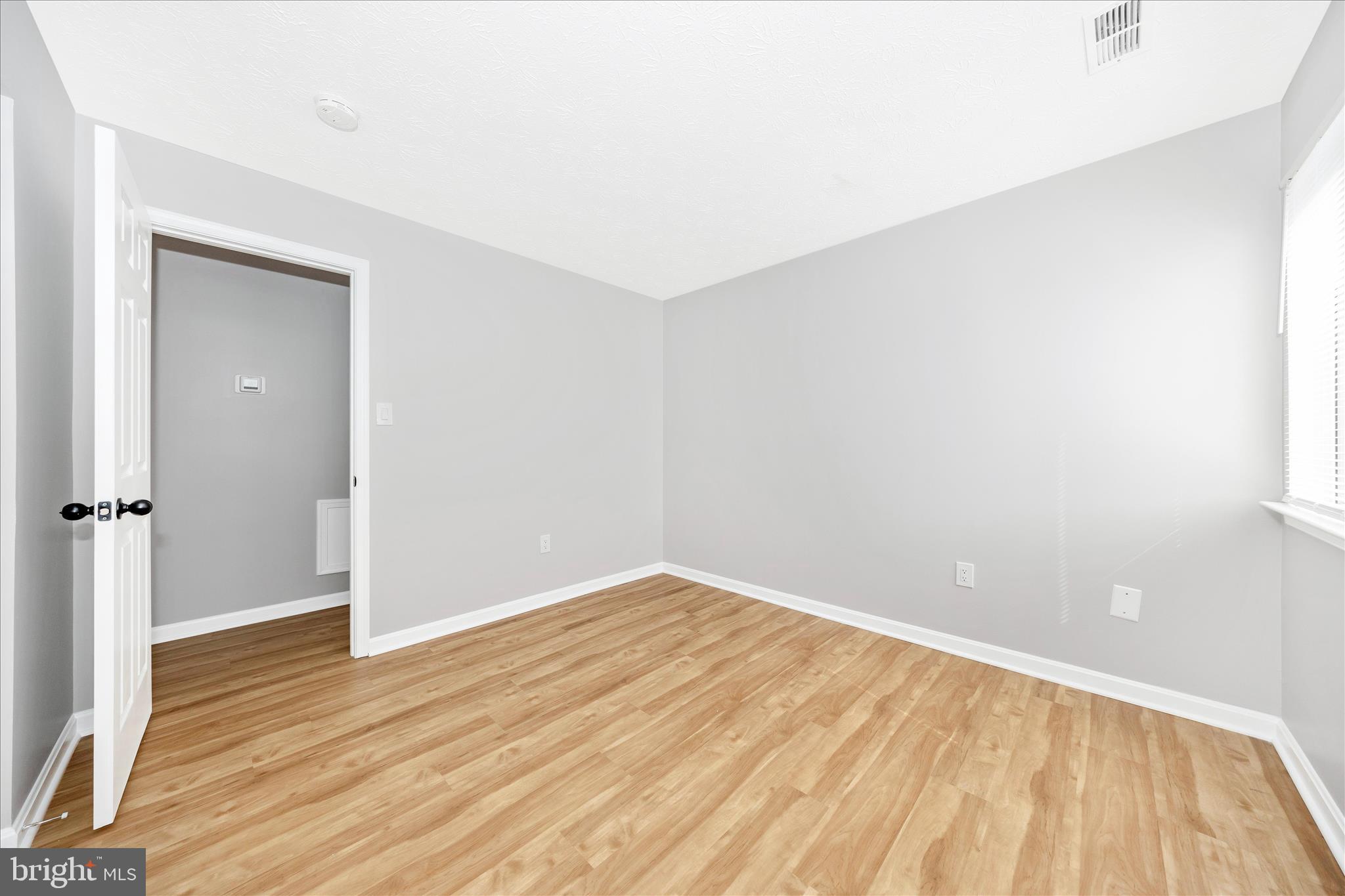 2137 Wainwright Court, Unit 1B Frederick, MD 21702 - Photo 34 of 55 an empty room with wooden floor and closet