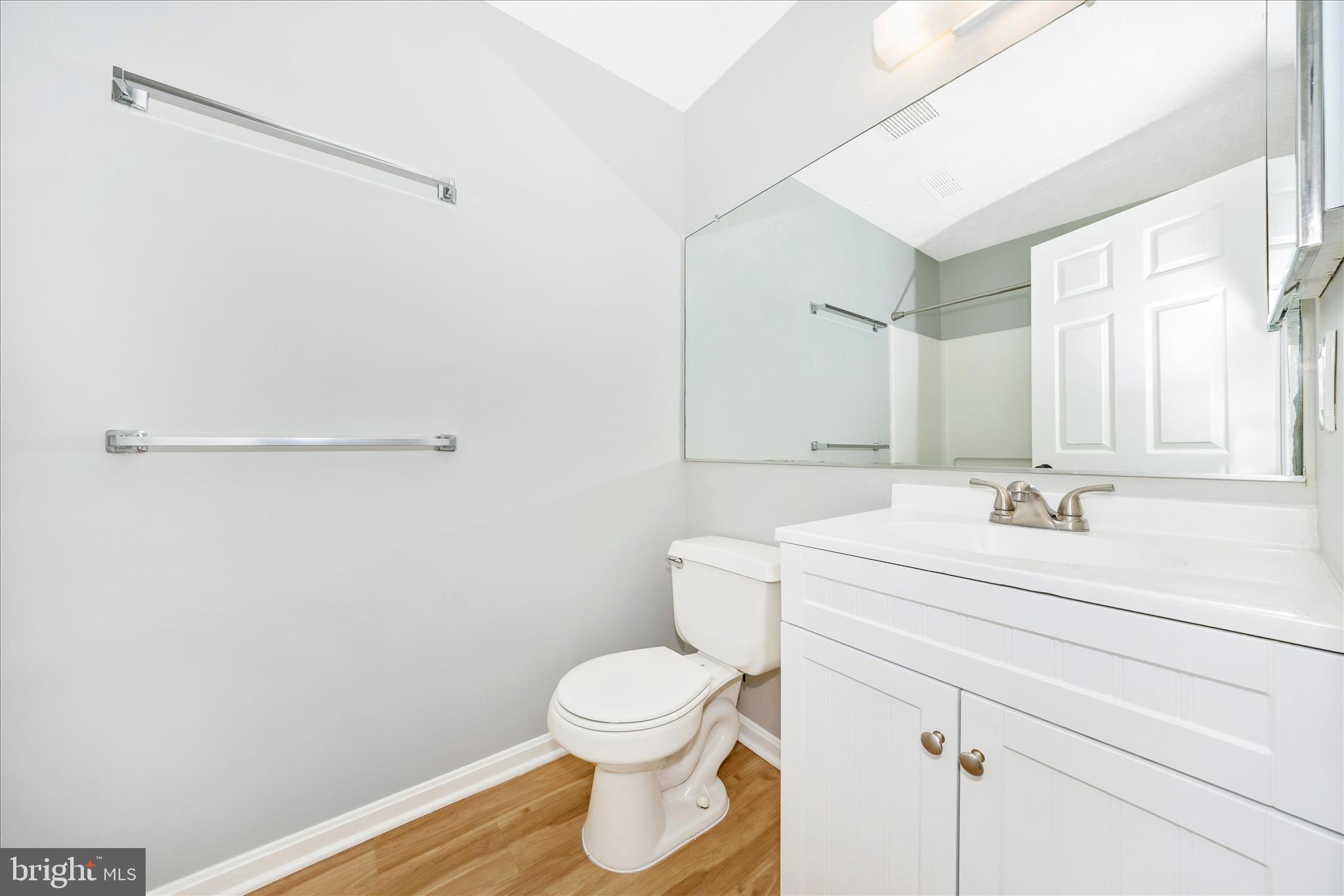 2137 Wainwright Court, Unit 1B Frederick, MD 21702 - Photo 35 of 55 a bathroom with a sink a toilet and a mirror