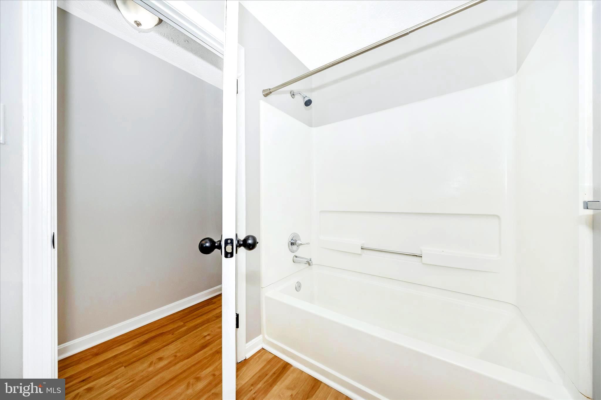 2137 Wainwright Court, Unit 1B Frederick, MD 21702 - Photo 36 of 55 a bathroom with a bathtub
