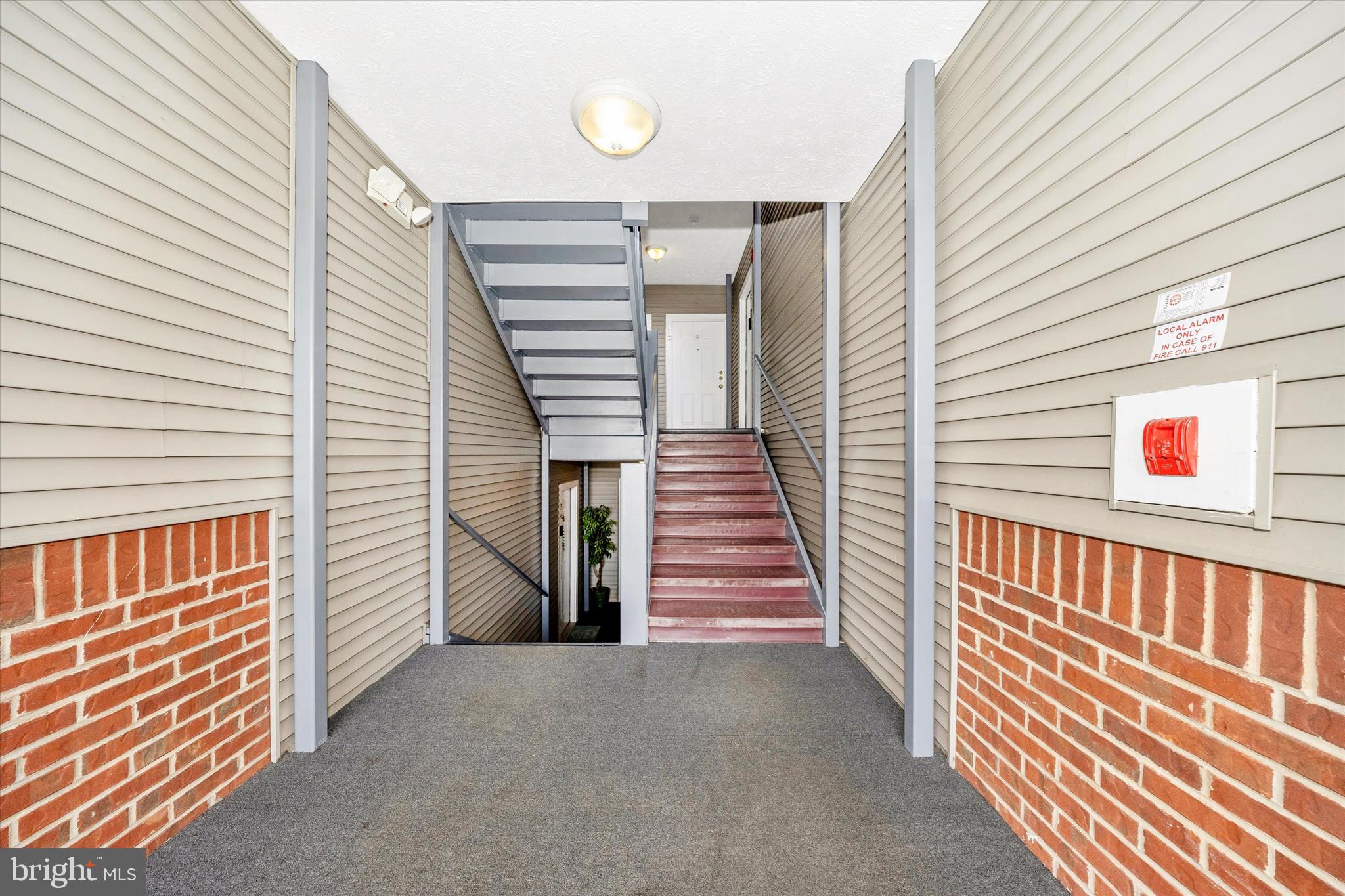 2137 Wainwright Court, Unit 1B Frederick, MD 21702 - Photo 46 of 55 a view of a balcony with stairs and wooden floor