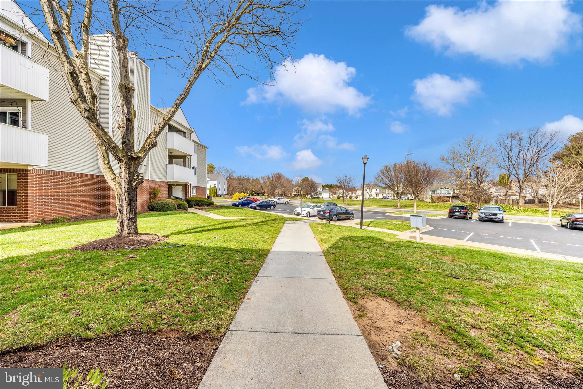 2137 Wainwright Court, Unit 1B Frederick, MD 21702 - Photo 49 of 55 a view of a yard with cars