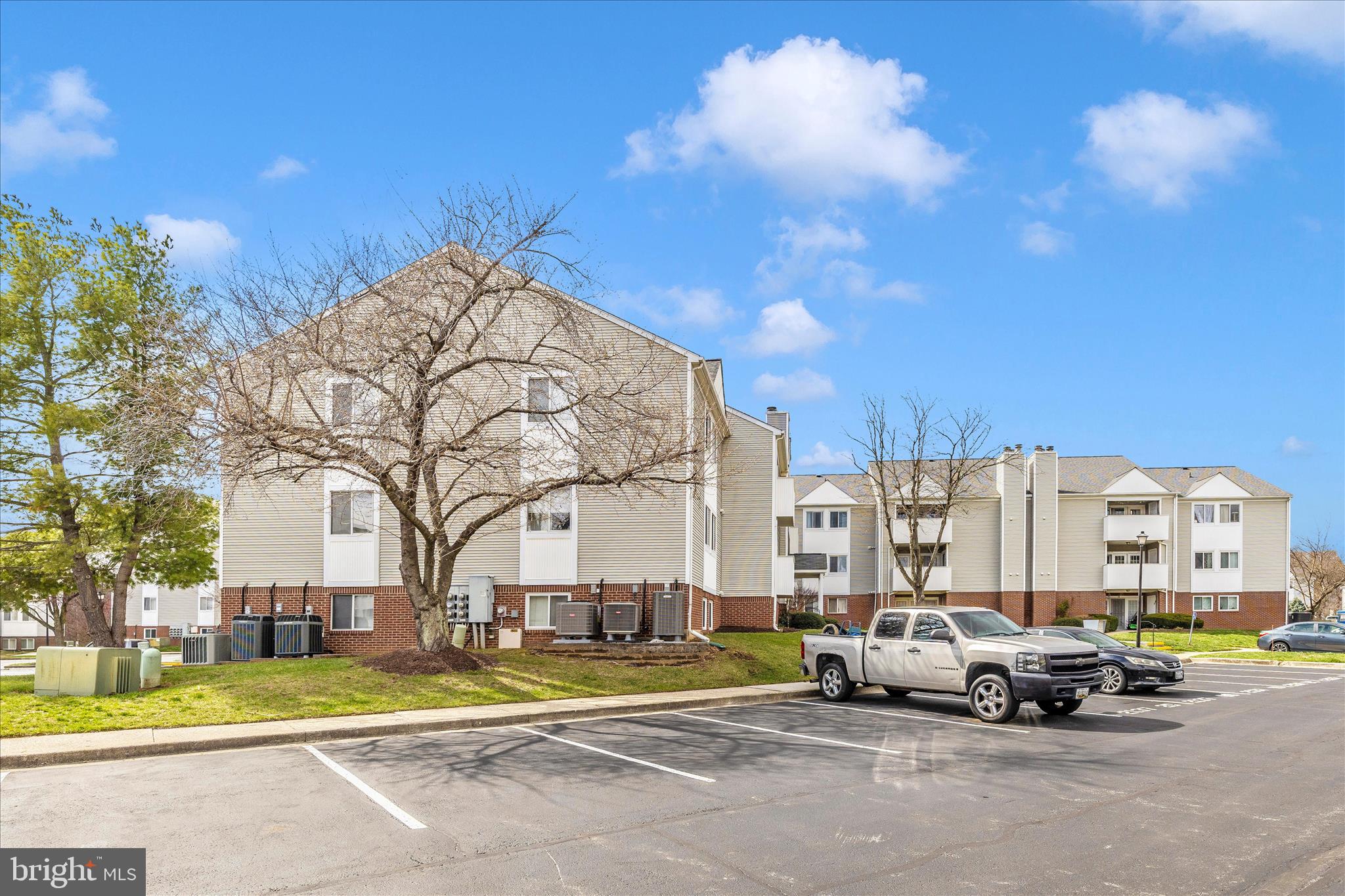 2137 Wainwright Court, Unit 1B Frederick, MD 21702 - Photo 52 of 55 a view of a cars parked in front of a building