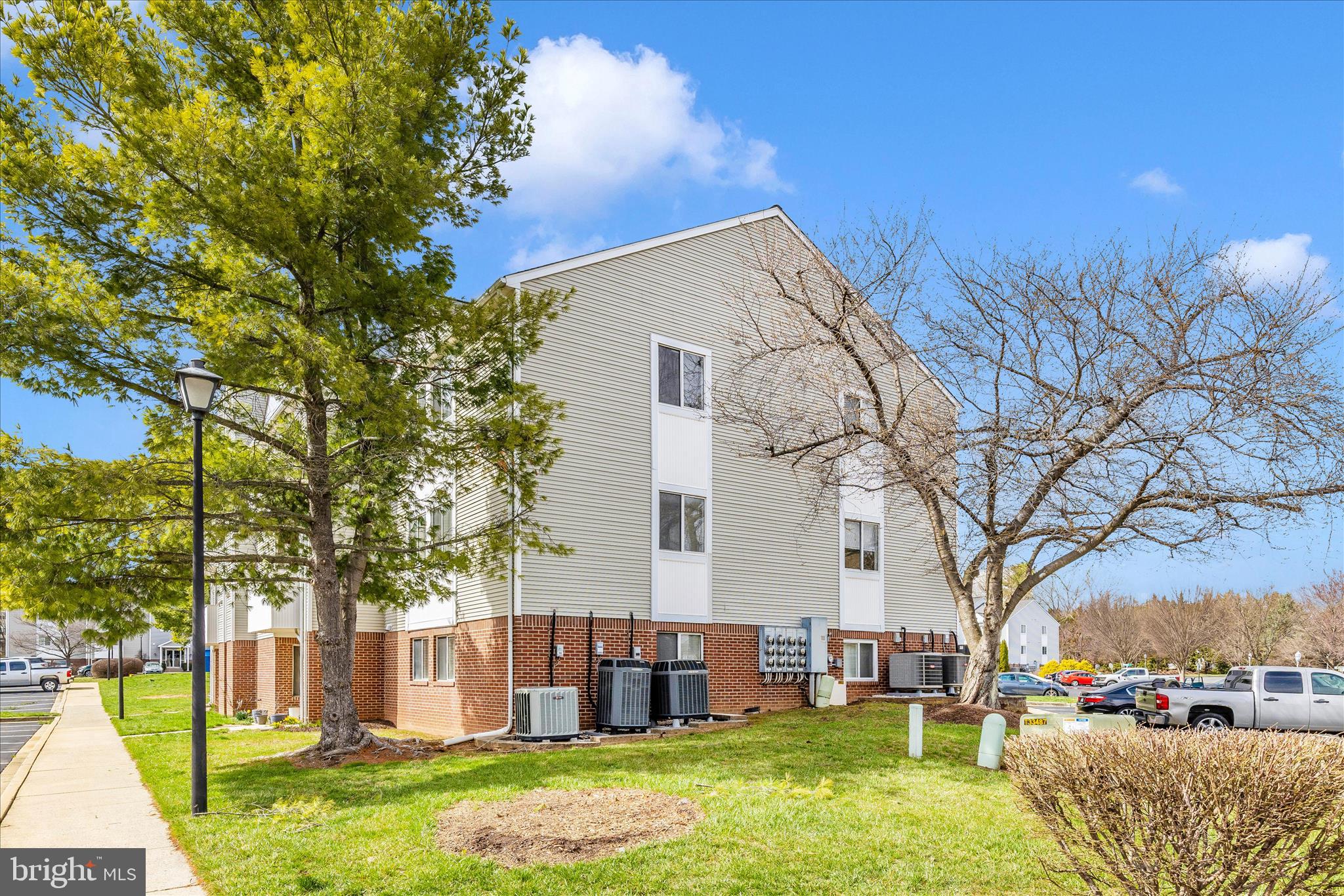 2137 Wainwright Court, Unit 1B Frederick, MD 21702 - Photo 53 of 55 a backyard of a house with garden and outdoor seating