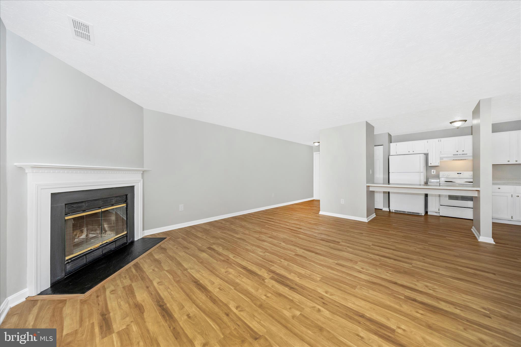 2137 Wainwright Court, Unit 1B Frederick, MD 21702 - Photo 8 of 55 a view of empty room with wooden floor