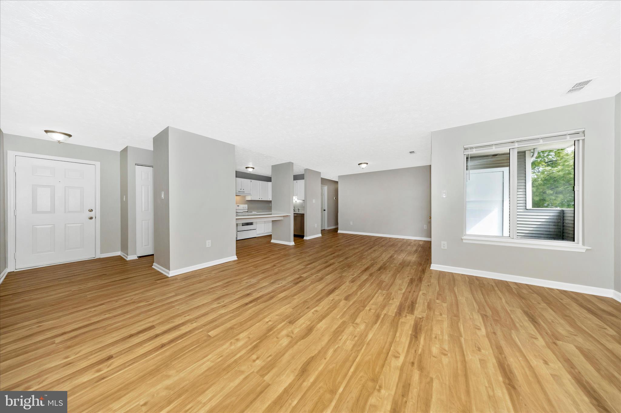 2137 Wainwright Court, Unit 1B Frederick, MD 21702 - Photo 9 of 55 a view of empty room with wooden floor and fan