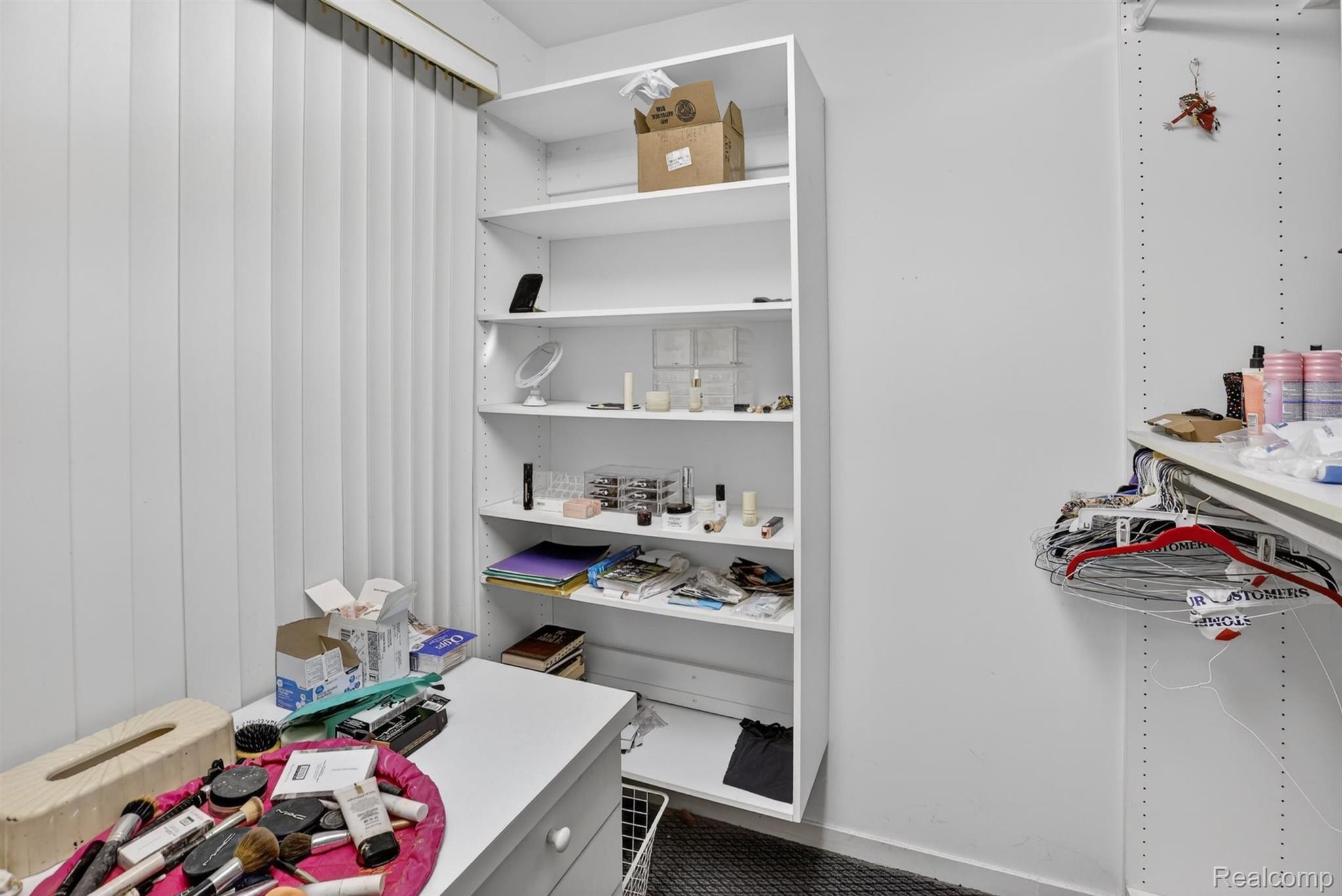 2197 South State Road Davison, MI 48423 - Photo 33 of 72 Built-in white shelving unit providing vertical storage