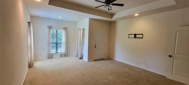 a view of a livingroom with a ceiling fan