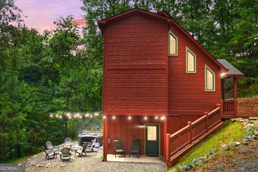 a view of a chairs setting in the backyard