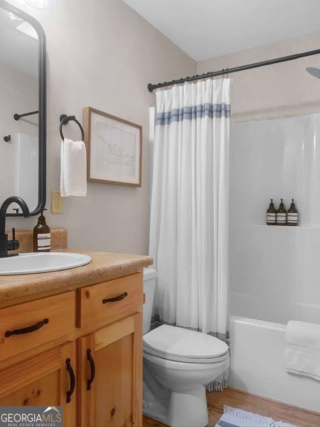 166 Riparian Way Ellijay, GA 30540 - Photo 24 of 34 a bathroom with a sink a toilet and shower