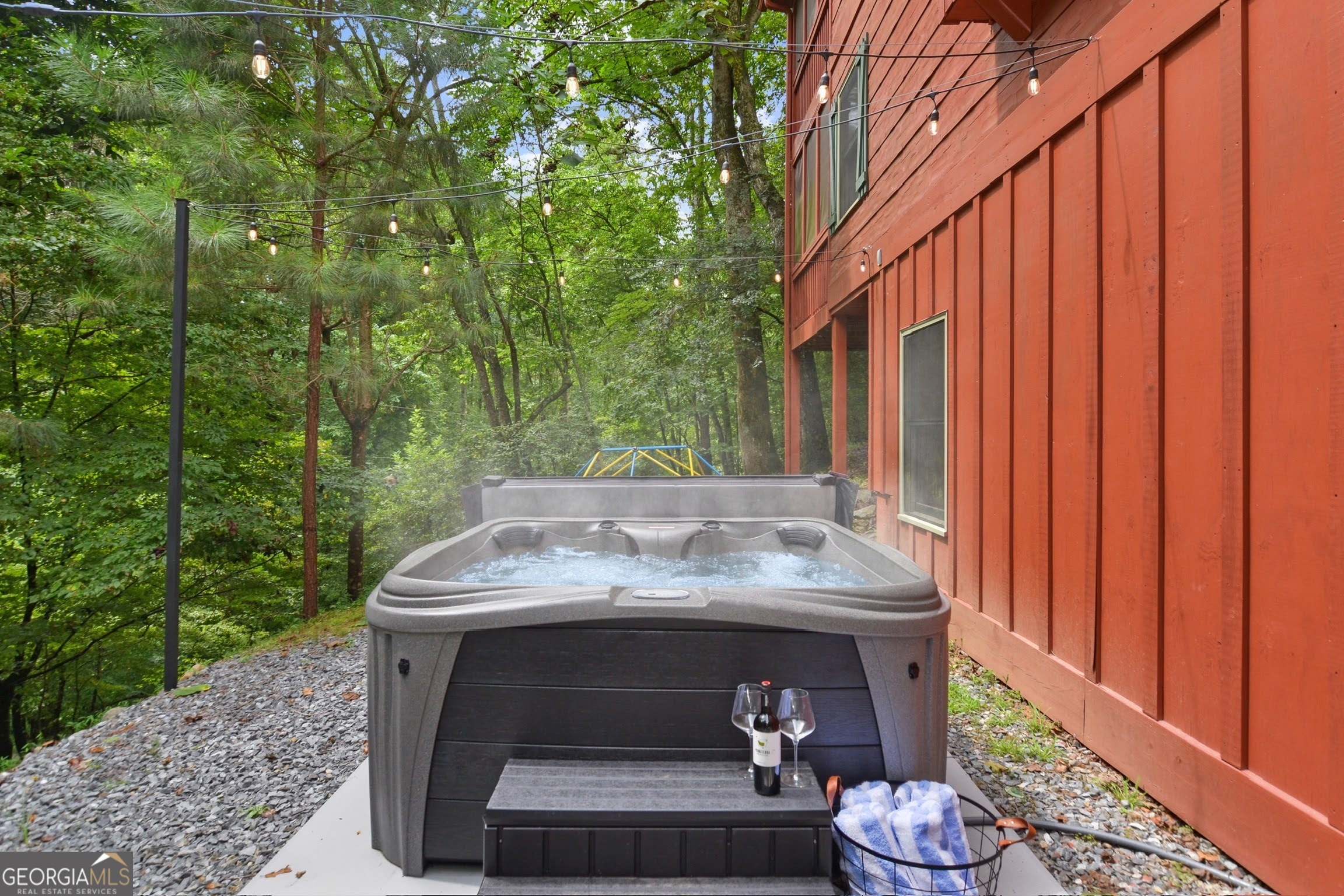 166 Riparian Way Ellijay, GA 30540 - Photo 26 of 34 a view of backyard with table and chairs and wooden fence