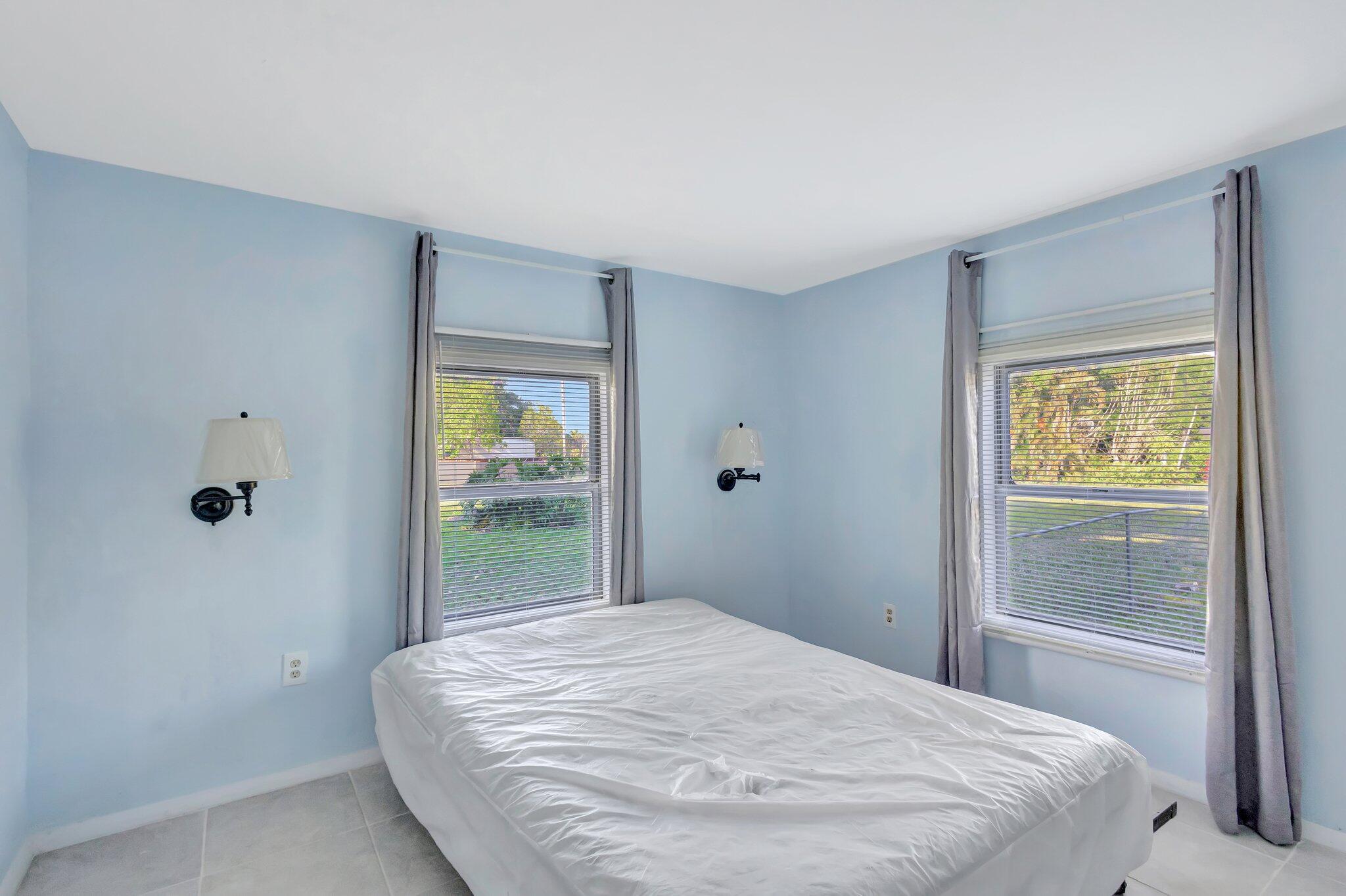 3539 Edwards Road Fort Pierce, FL 34981 - Photo 14 of 39 a bedroom with a bed and a window